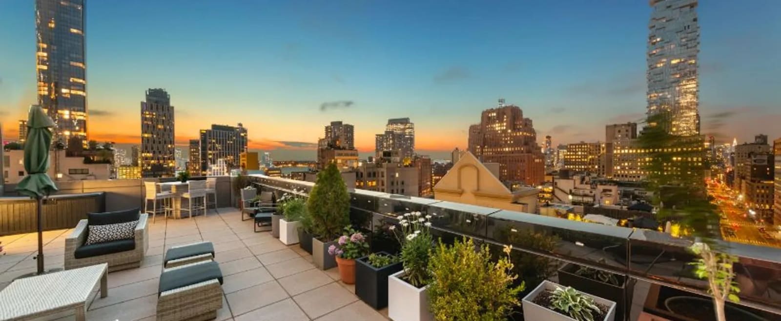 Luxury rooftop terrace in Tribeca with landscaped outdoor living space and Manhattan views