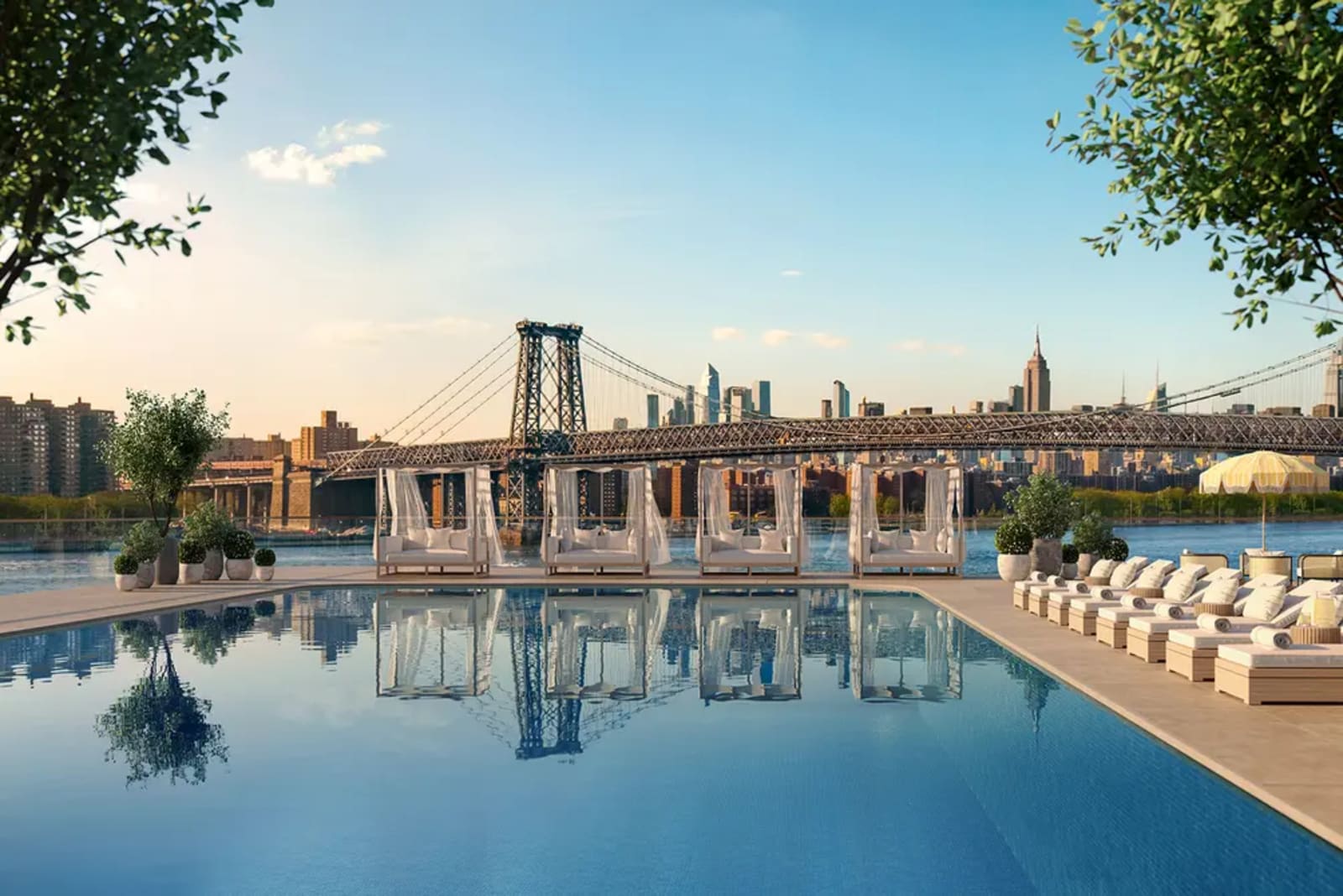 Luxury rooftop swimming pool with Manhattan skyline views in a high-end residential building