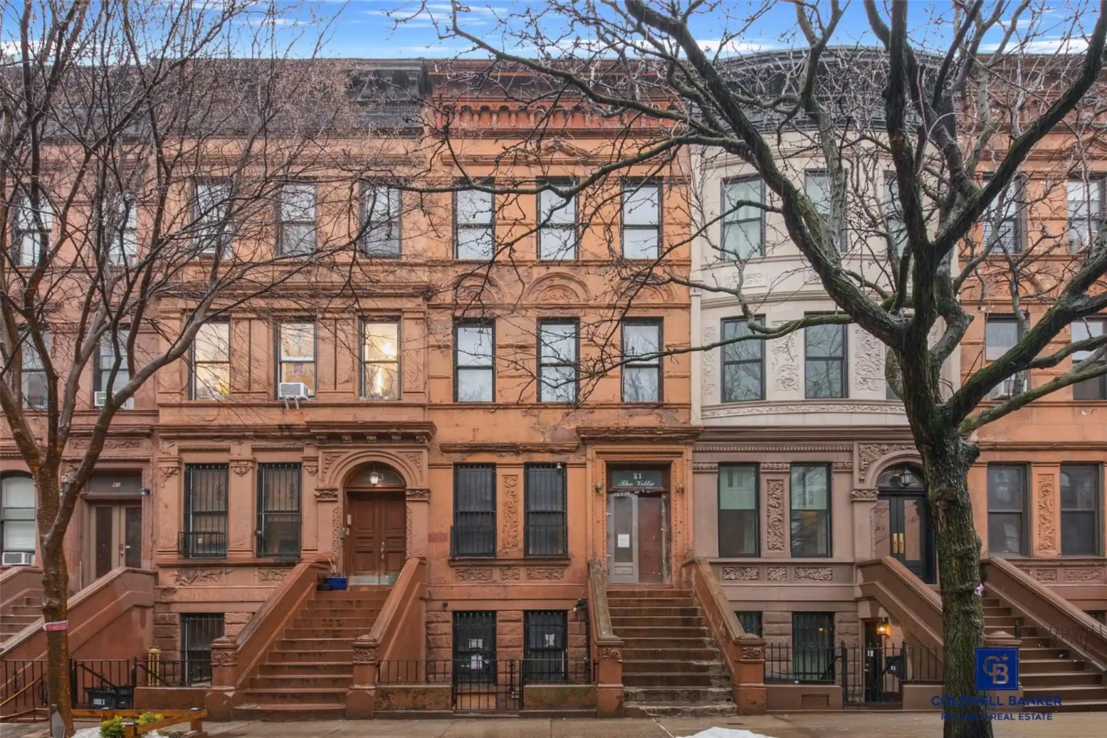 Manhattan townhouse with for-sale sign during the spring selling season in NYC