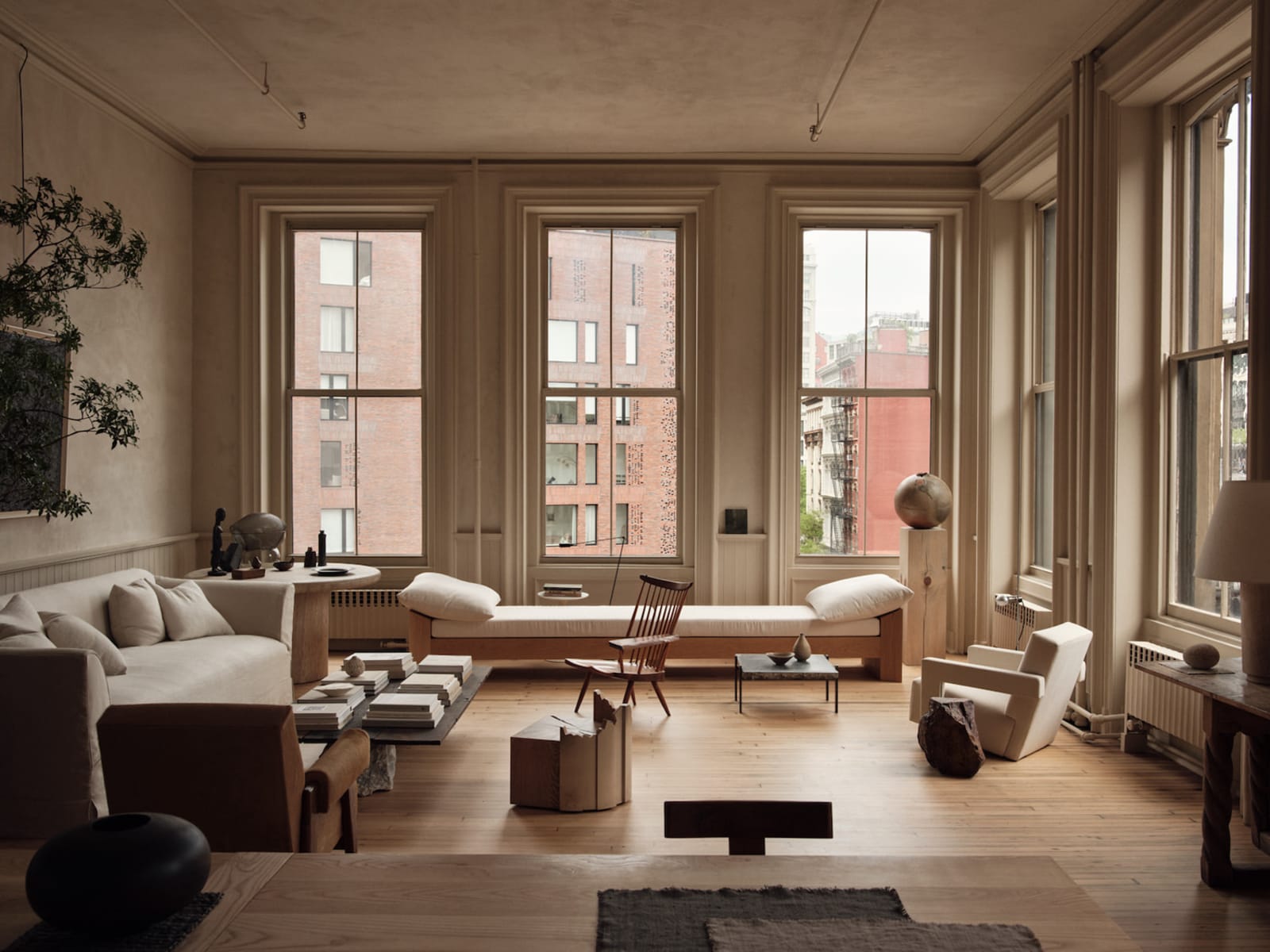 A sunlit Tribeca loft with warm wood floors and tall windows