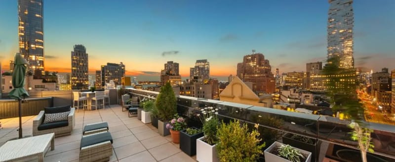 Luxury rooftop terrace in Tribeca with landscaped outdoor living space and Manhattan views