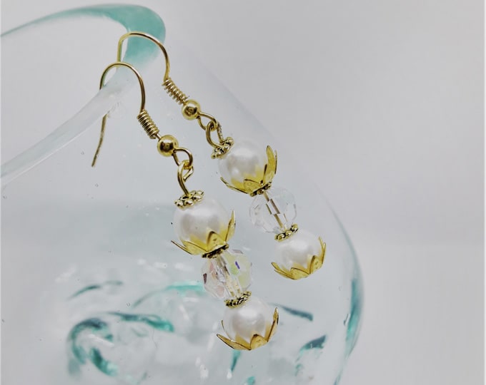 Gold earrings with large pearls