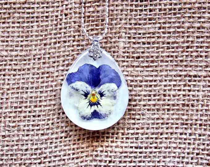 $45 shipped #pansie #pendant with #white in the daytime & #blue #luminescent background in the dark hung on #silver #chain #glowinthedark #…