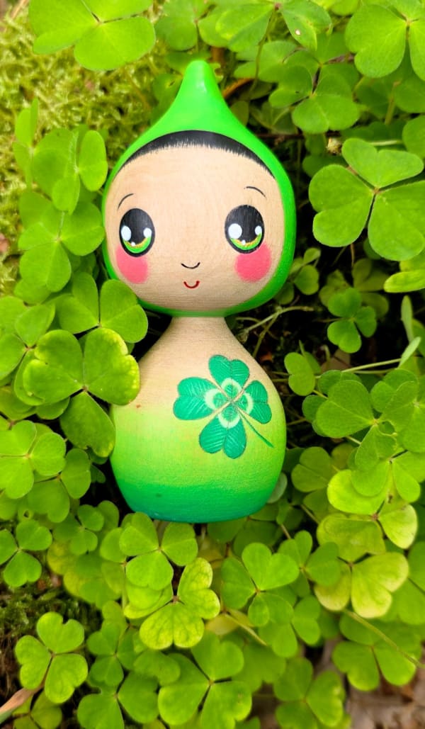 Kokeshi style doll with four leaf clover