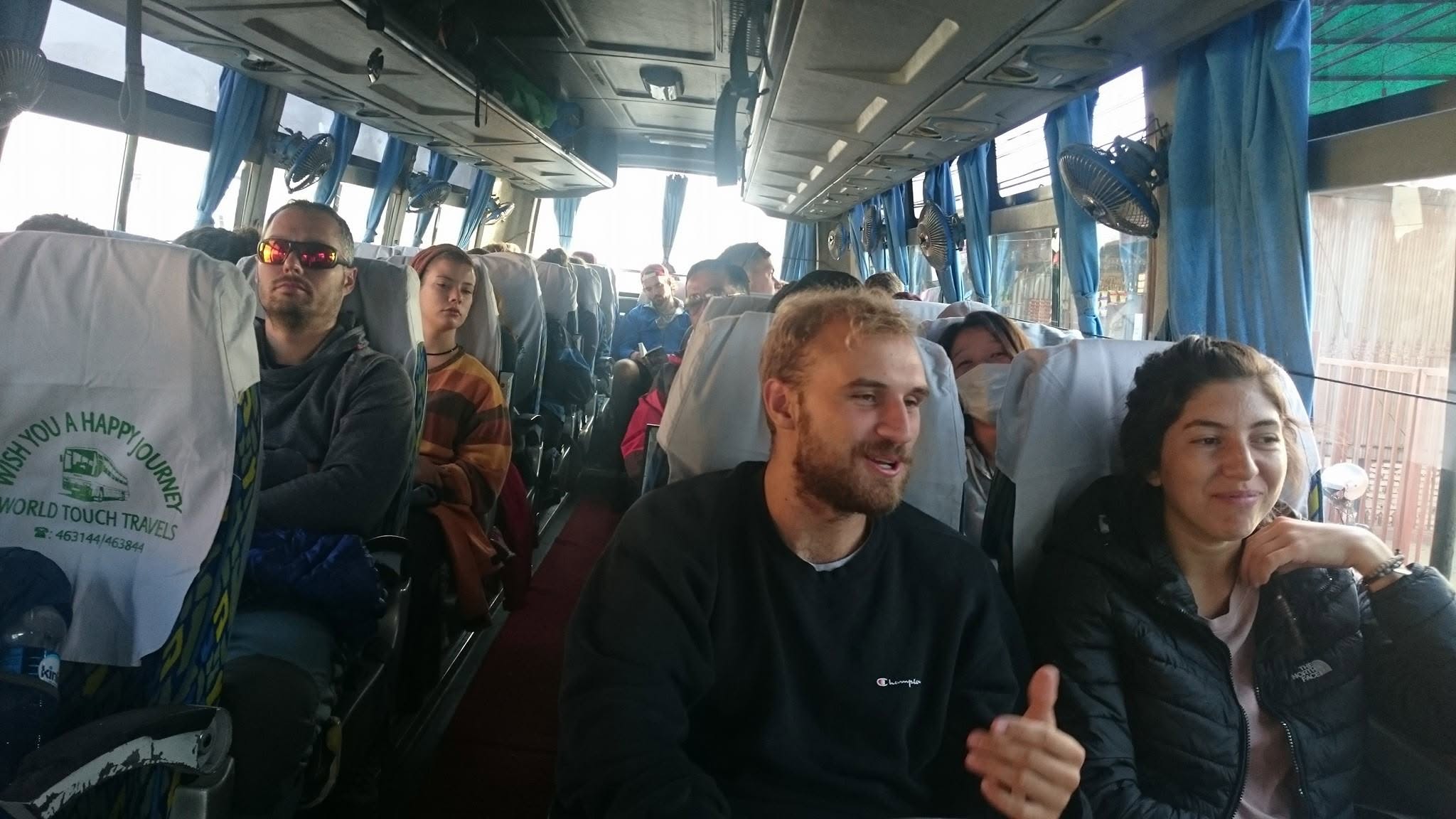 World Touch bus interior with branded headrests
