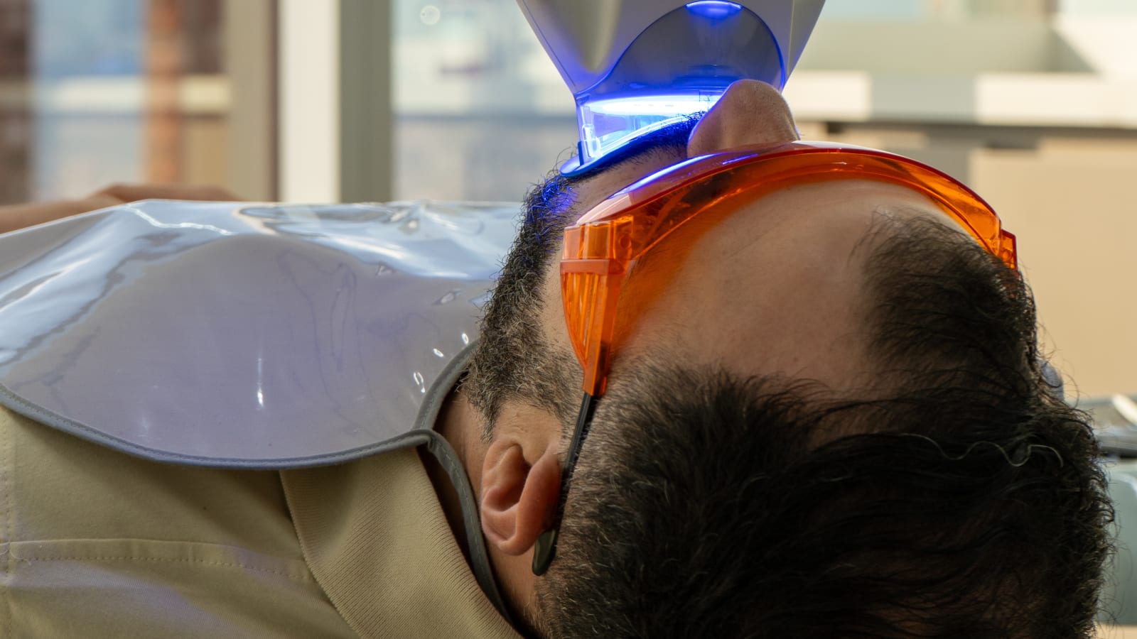 Patient reviewing dental treatment paperwork at Colombia Care Dental, Medellín