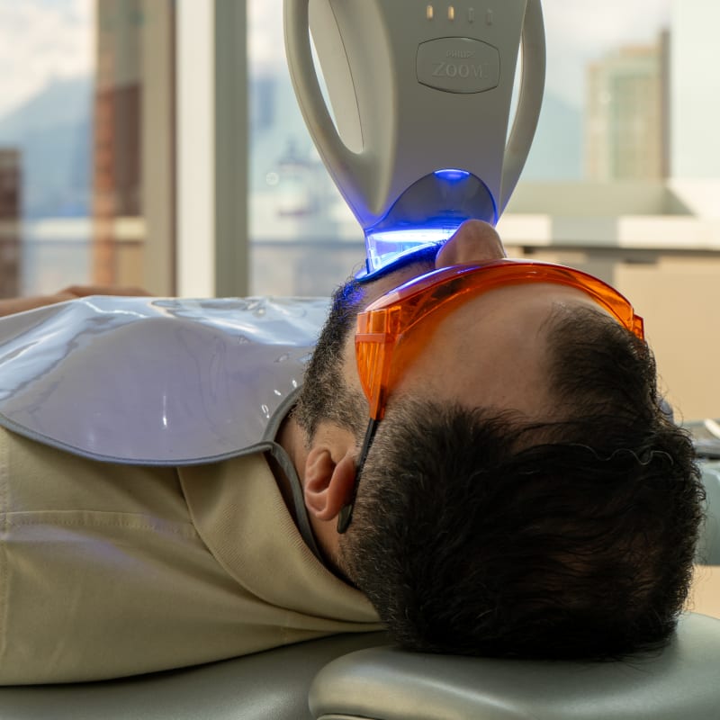 Patient reviewing dental treatment paperwork at Colombia Care Dental, Medellín