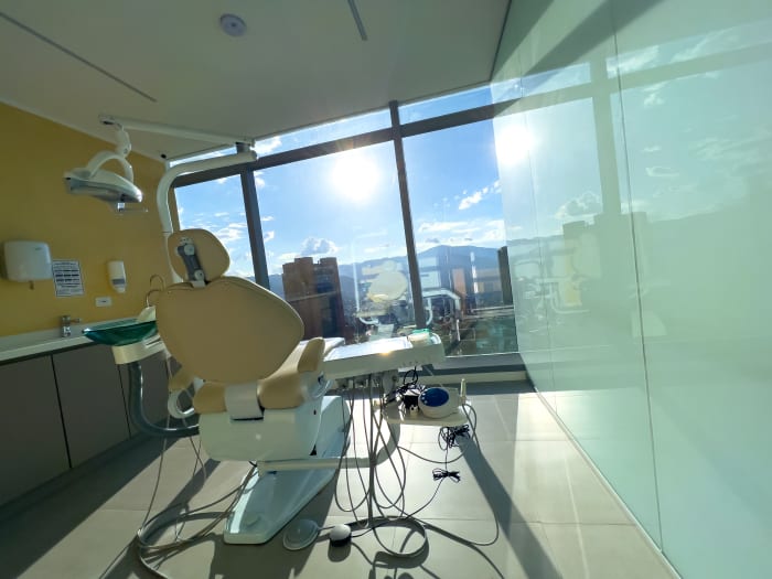 Modern dental operatory with floor-to-ceiling windows, Medellín