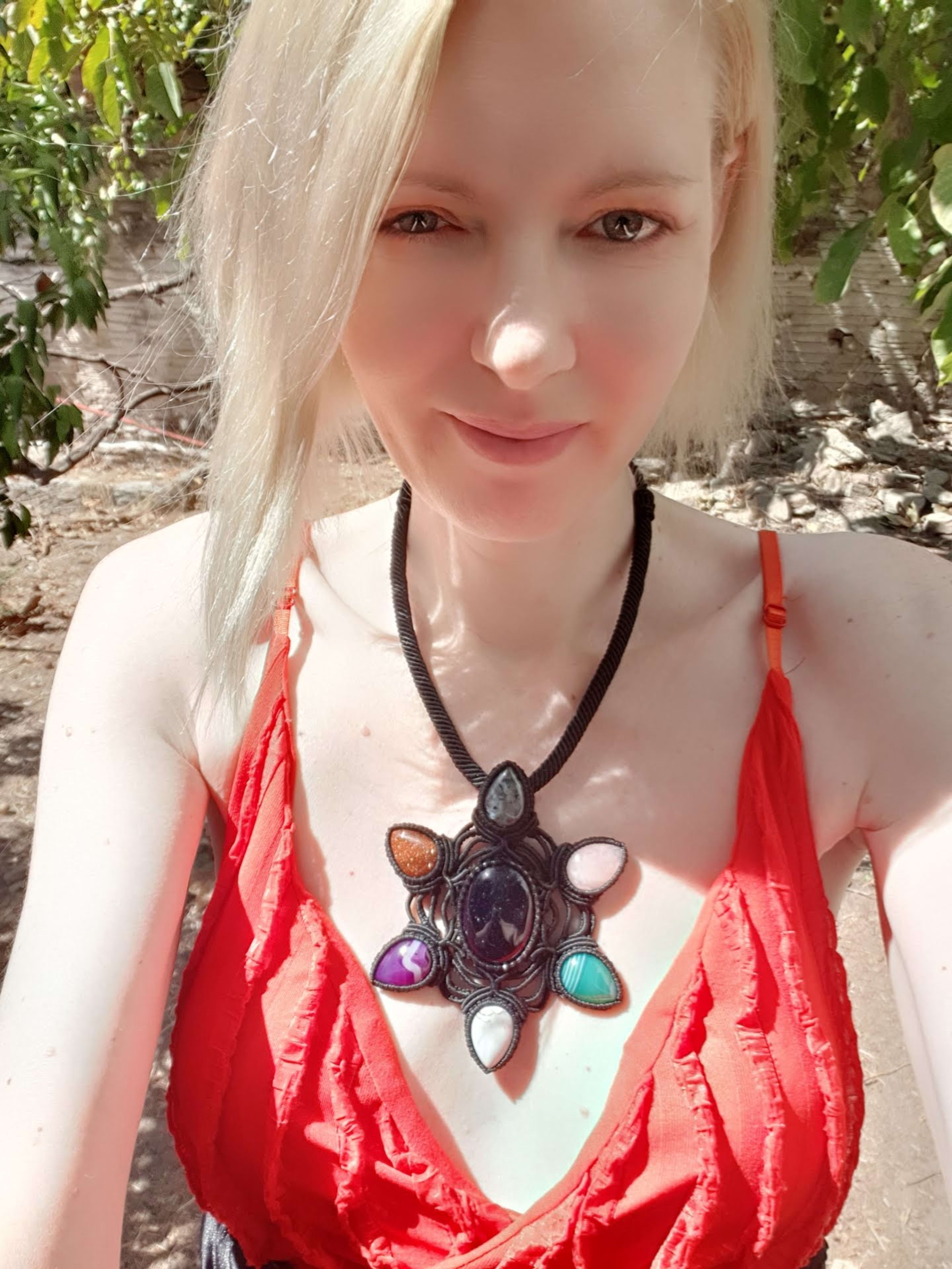  Sacred Geometry Blue Goldstone Center Pendant, surrounded by a handcrafted Macrame Gemstone Necklace with six more stones.