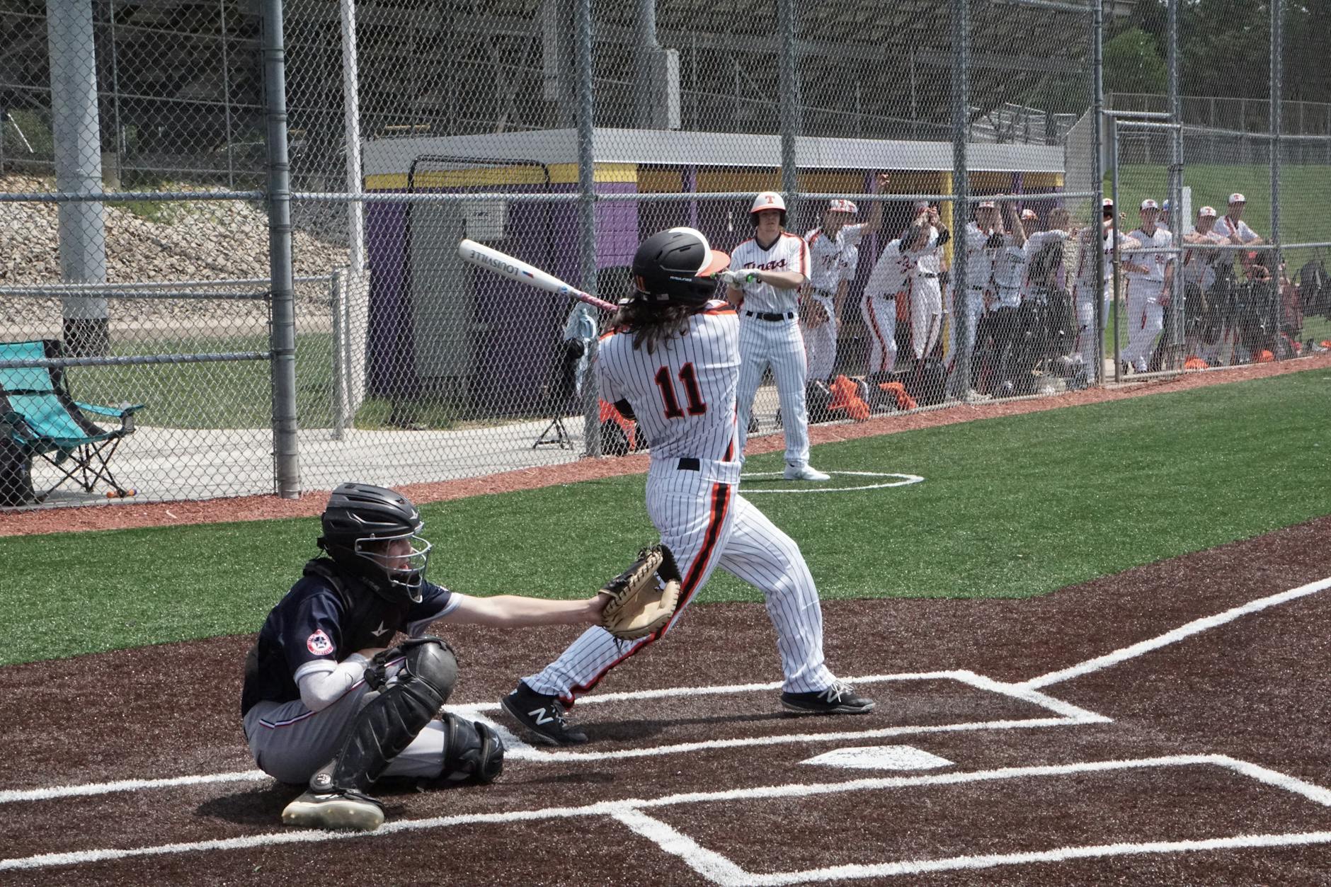 Oswego East's Tucker Unleashes Two-Homer Barrage to Secure Series Dominance Over Rivals