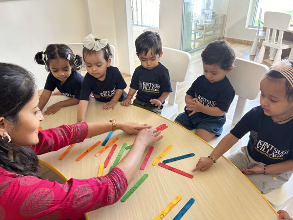 Children celebrating with birthday hats