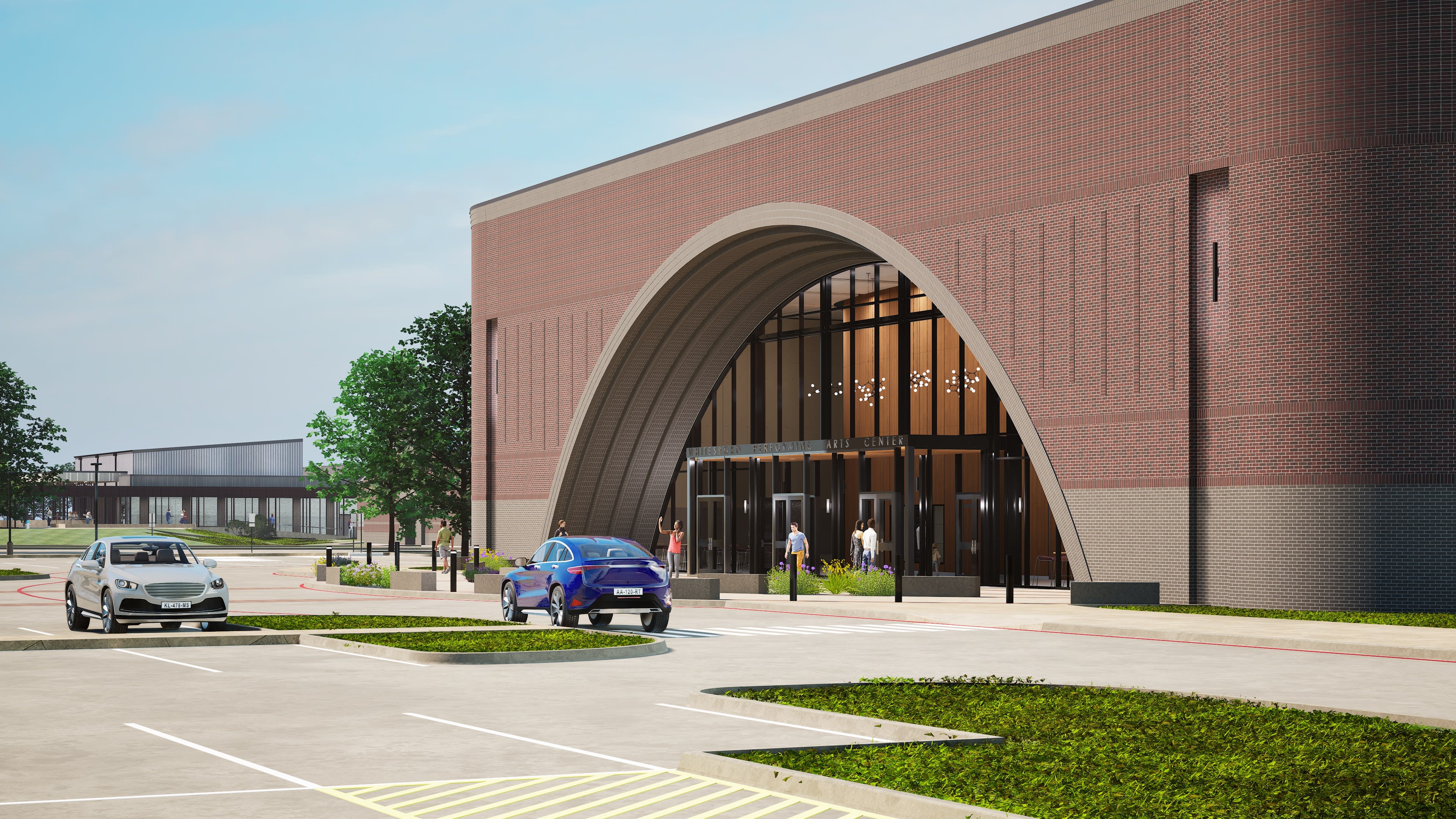 Whitesboro PAC &mdash; parking lot approach to arched entry