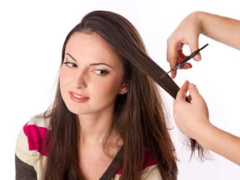 Stylist giving a precision haircut