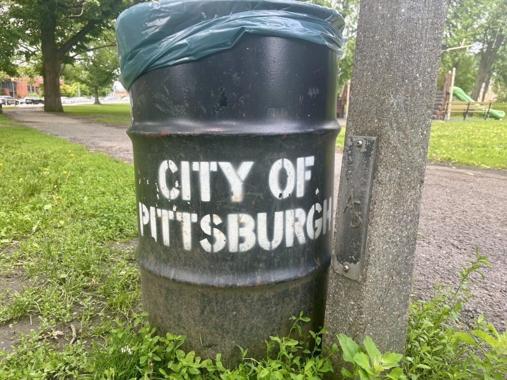 City of Pittsburgh trash can in a park