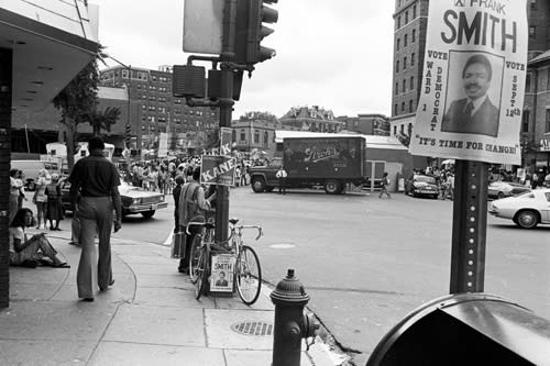 A rooftop view of homes covered in snow. 