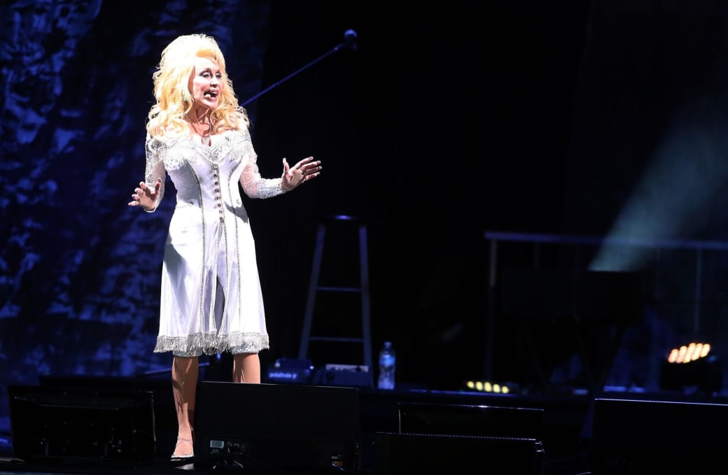 Dolly Parton sings on a stage at Laughlin Event Center in 2016. 