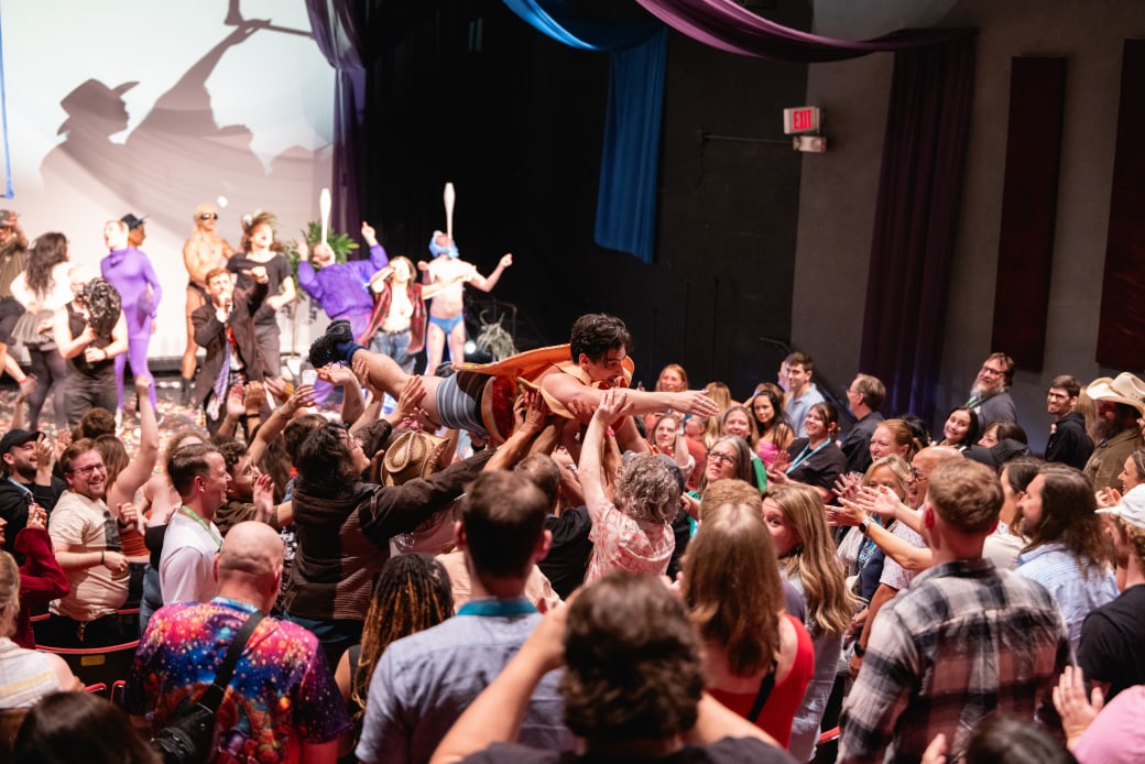 A person crowdsurfing.