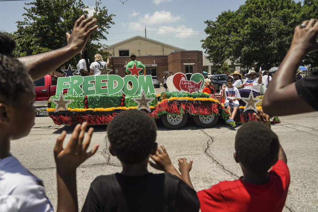 A Juneteenth parade float that says "Freedom."