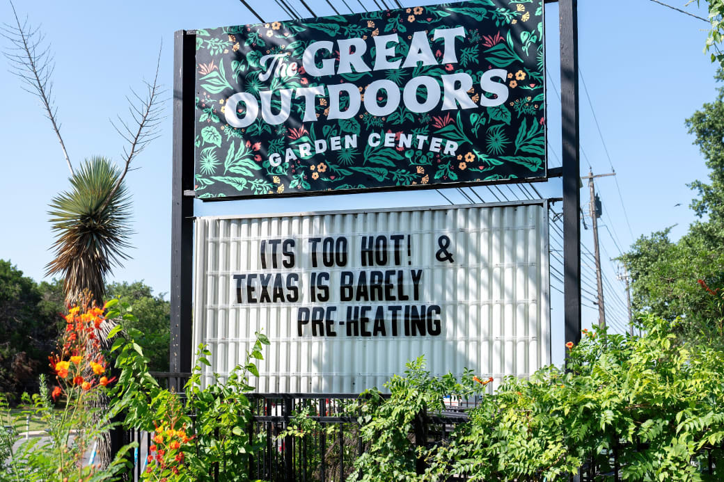 A marquee sign that says "It's too hot! & Texas is barely pre-heating."