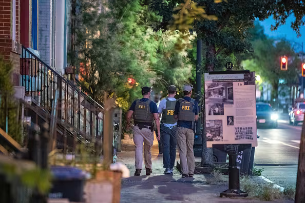 FBI officers seen walking in LeDroit Park. (The Washington Post/Getty Images)