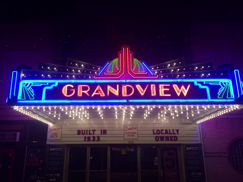 A big neon sign that reads "grandview theater"