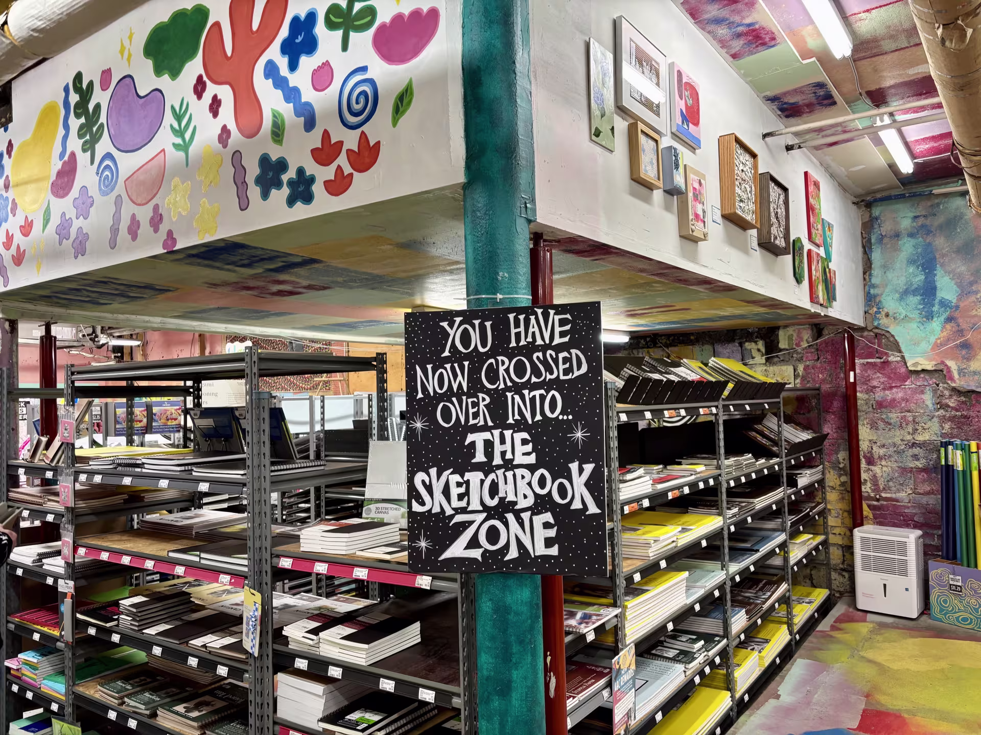shelves of sketchbooks
