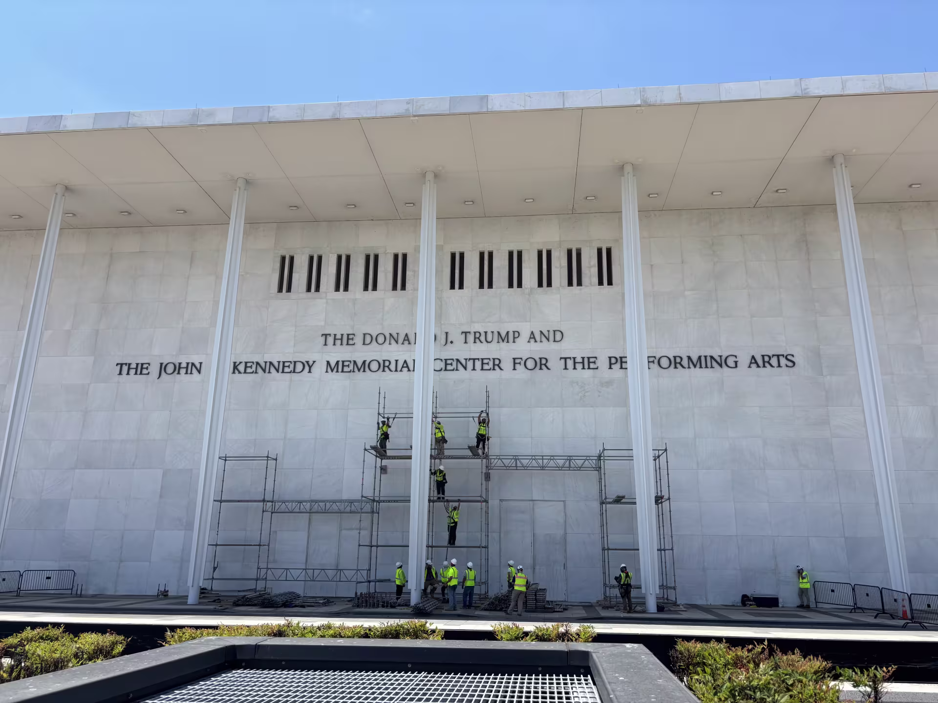 Scaffolding outside the Kennedy Center on Friday, June 12. A federal judge last month ordered President Donald Trump's name removed from the venue's facade. (Emma Uber/City Cast DC)