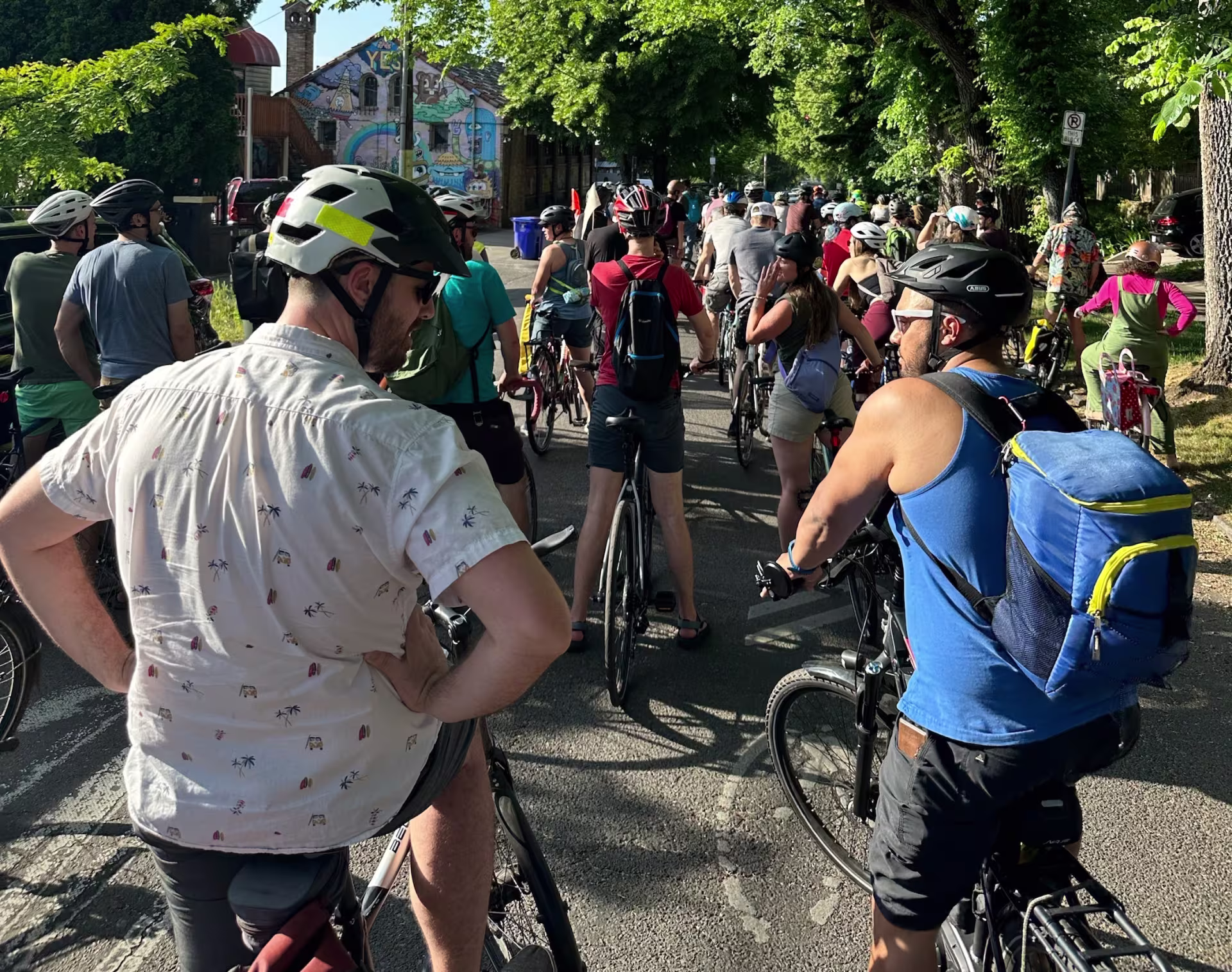 cyclists out for a group ride on a leafy street in Portland, Oregon