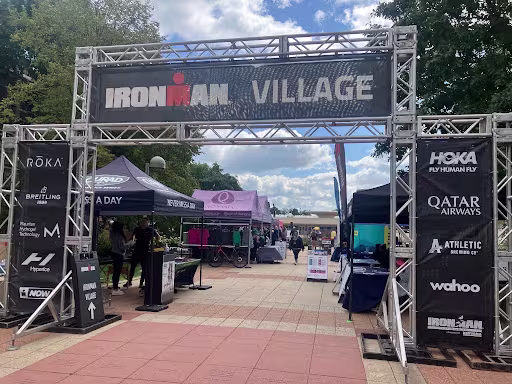 A sign reads "Ironman Village"