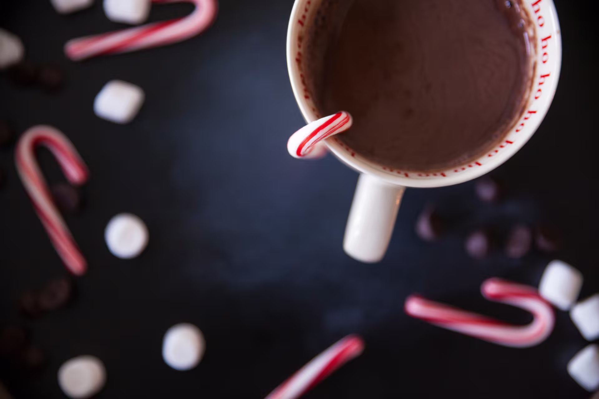 Mug of hot chocolate with candy canes