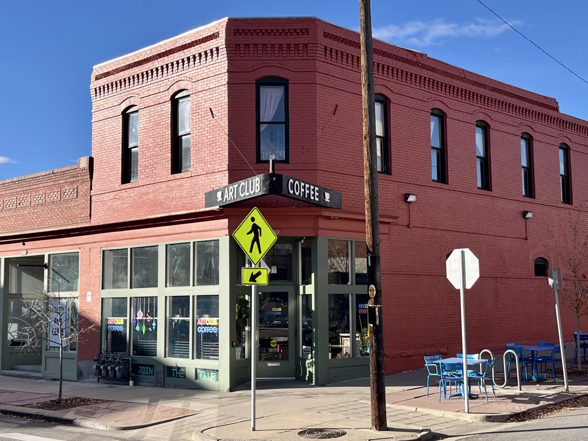 Corner buildings made of brick house a coffee shop