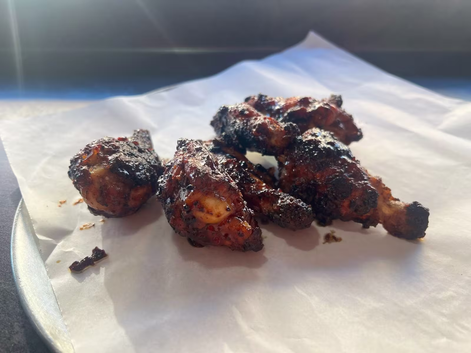 Chicken wings on a napkin on a plate