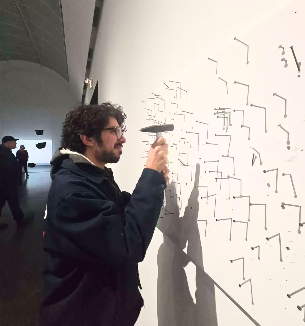 Hammering nails at MCA's Yoko Ono exhibit