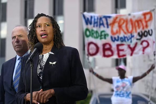 D.C. Mayor Muriel Bowser speaks, flanked by Attorney General for D.C. Brian Schwalb, outside the US District Courthouse. (Jim Watson/Getty Images)