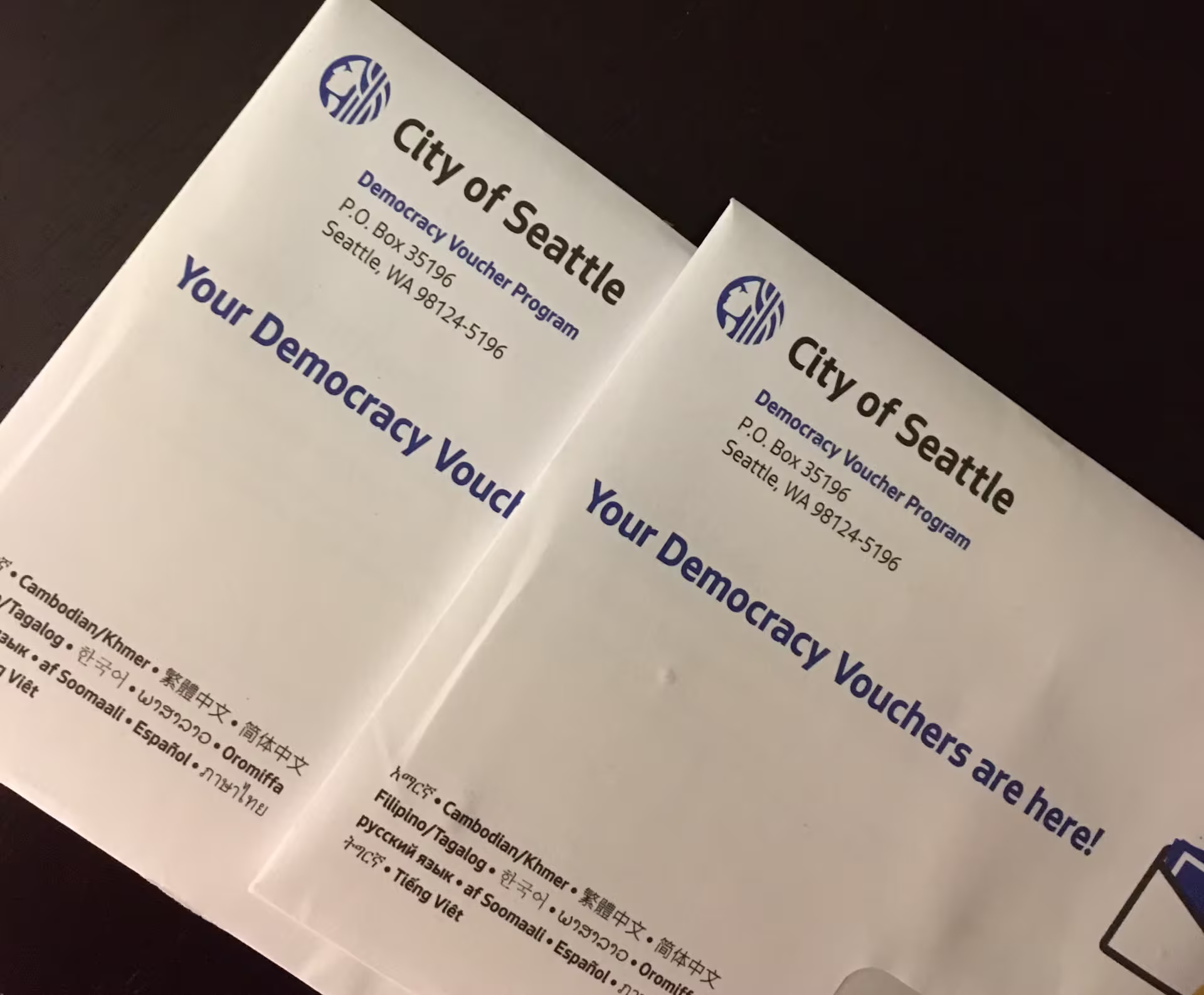 Two envelopes with City of Seattle democracy vouchers
