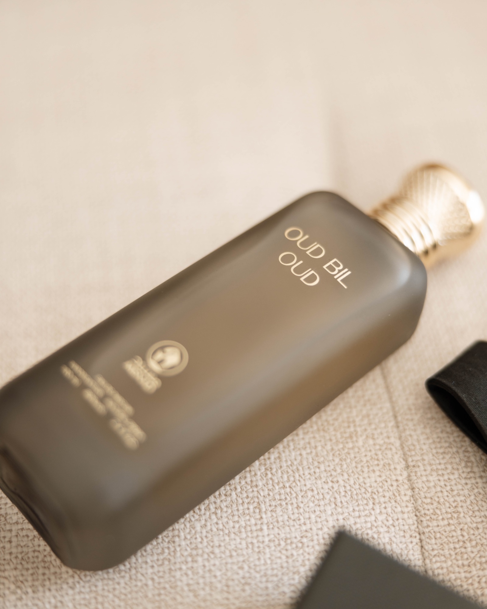 The groom's cologne on the linen before he dresses