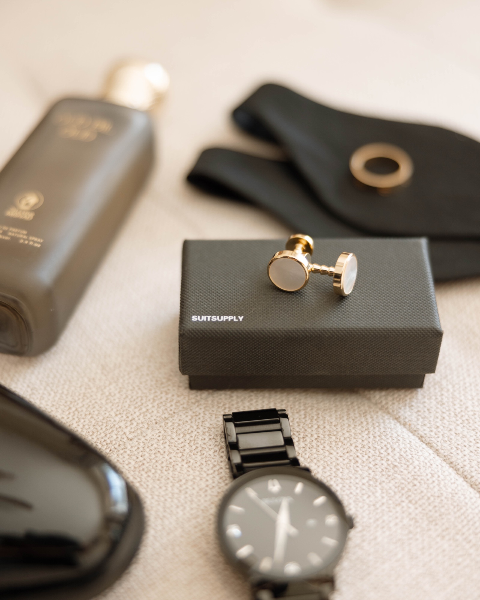 The groom's accessories arranged beside his patent shoes
