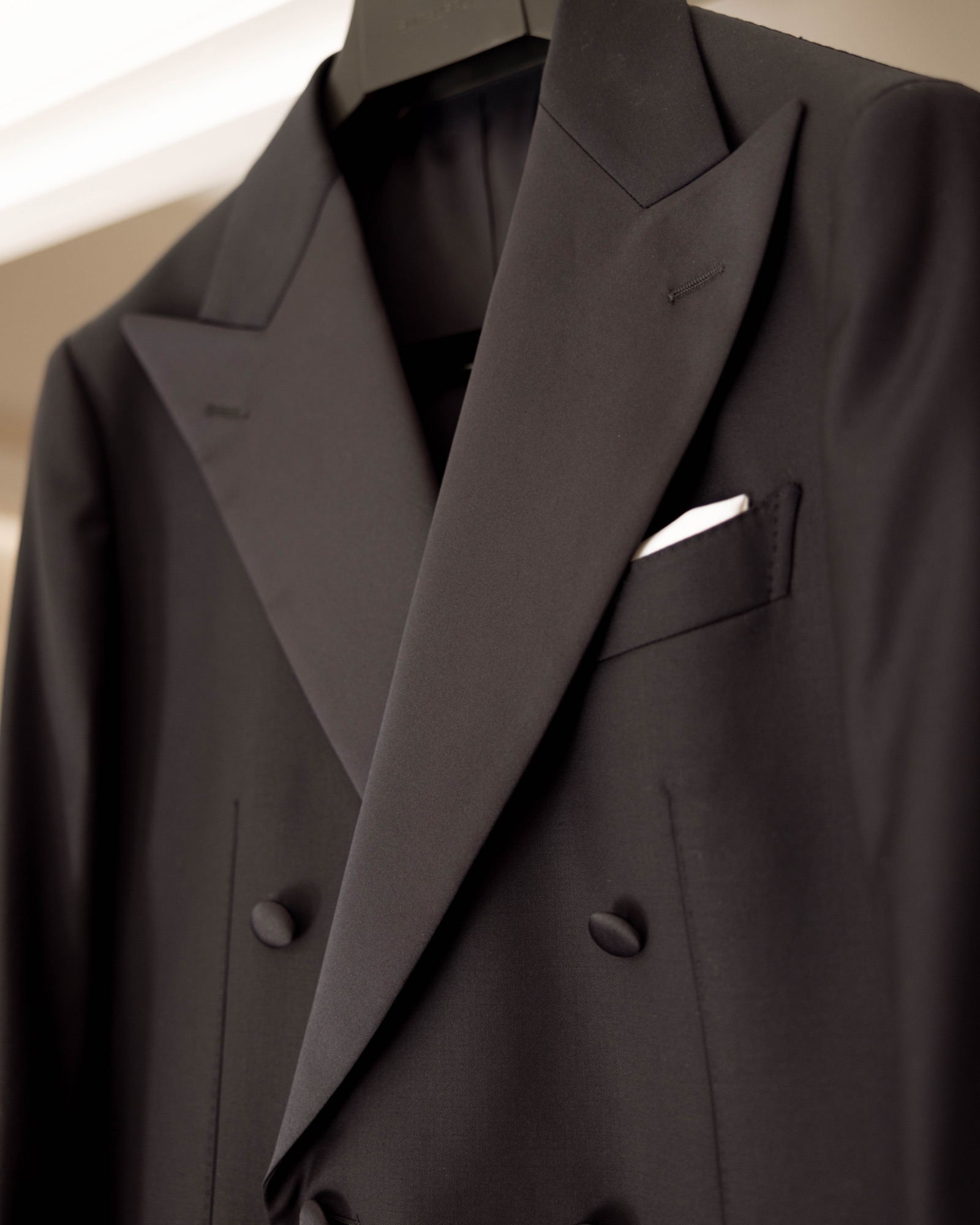 Detail of the tuxedo's peak lapel and pocket square