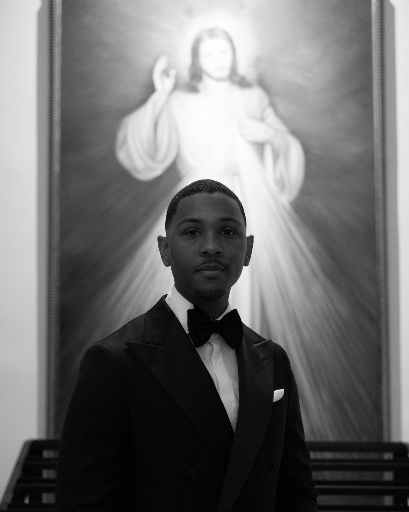 The groom before the Divine Mercy image in the church