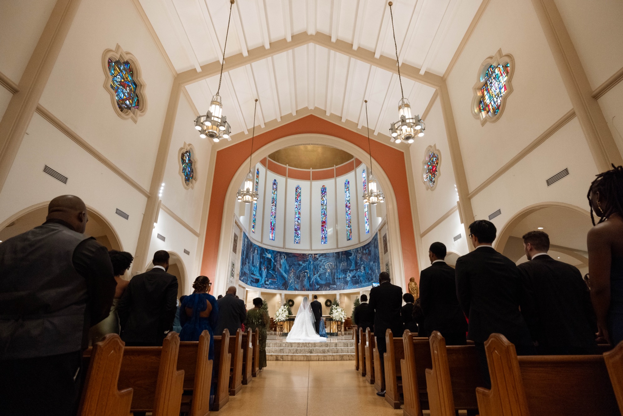 The nave and stained glass during the Catholic ceremony