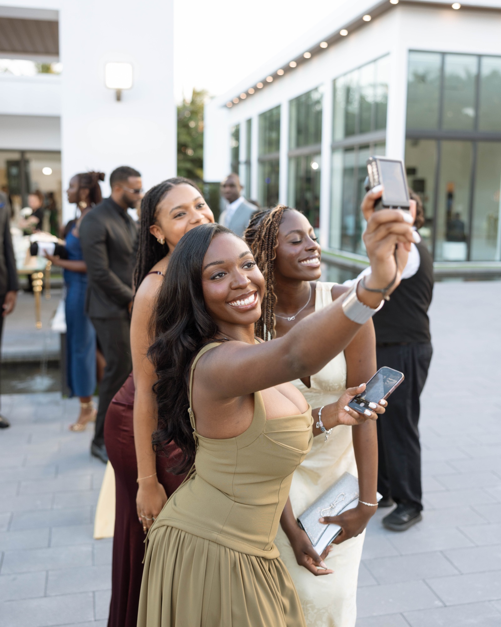 Guests taking a photograph together during cocktail hour