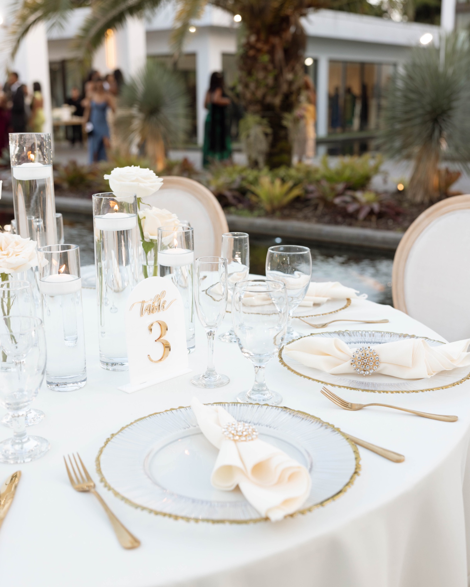 A tablescape at table three, gold and white