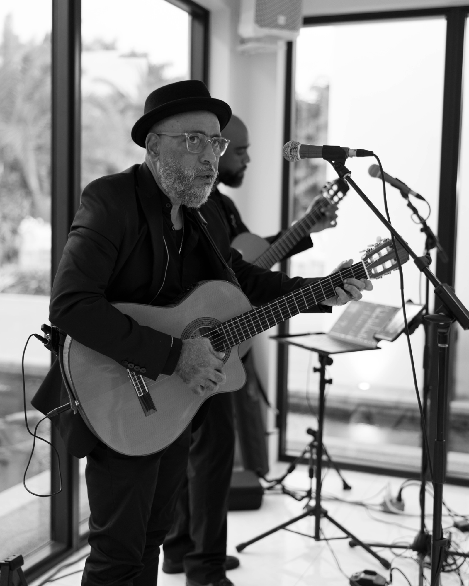 The guitarist during cocktail hour, black and white