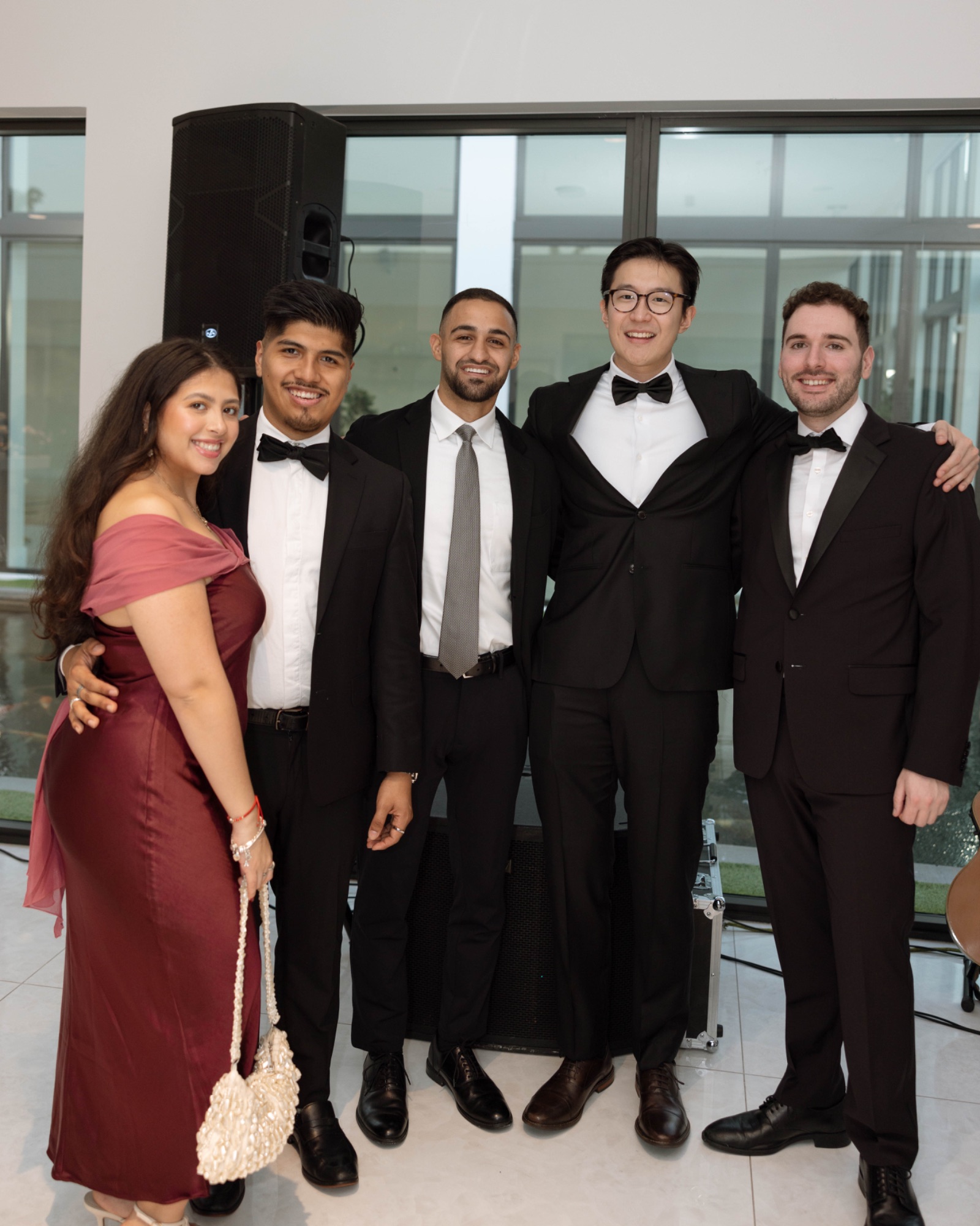 A group of guests in black tie