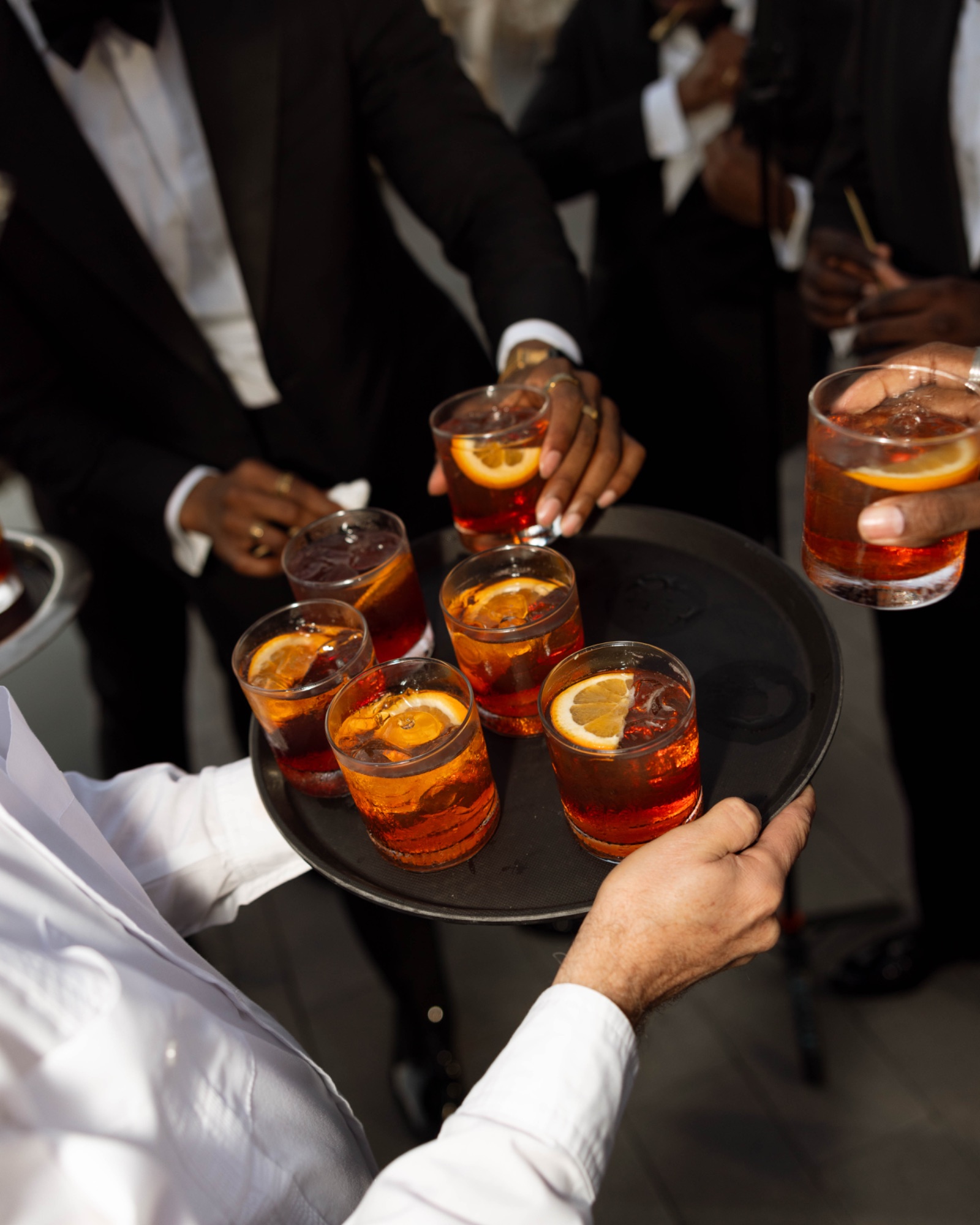 A tray of negronis carried into the reception