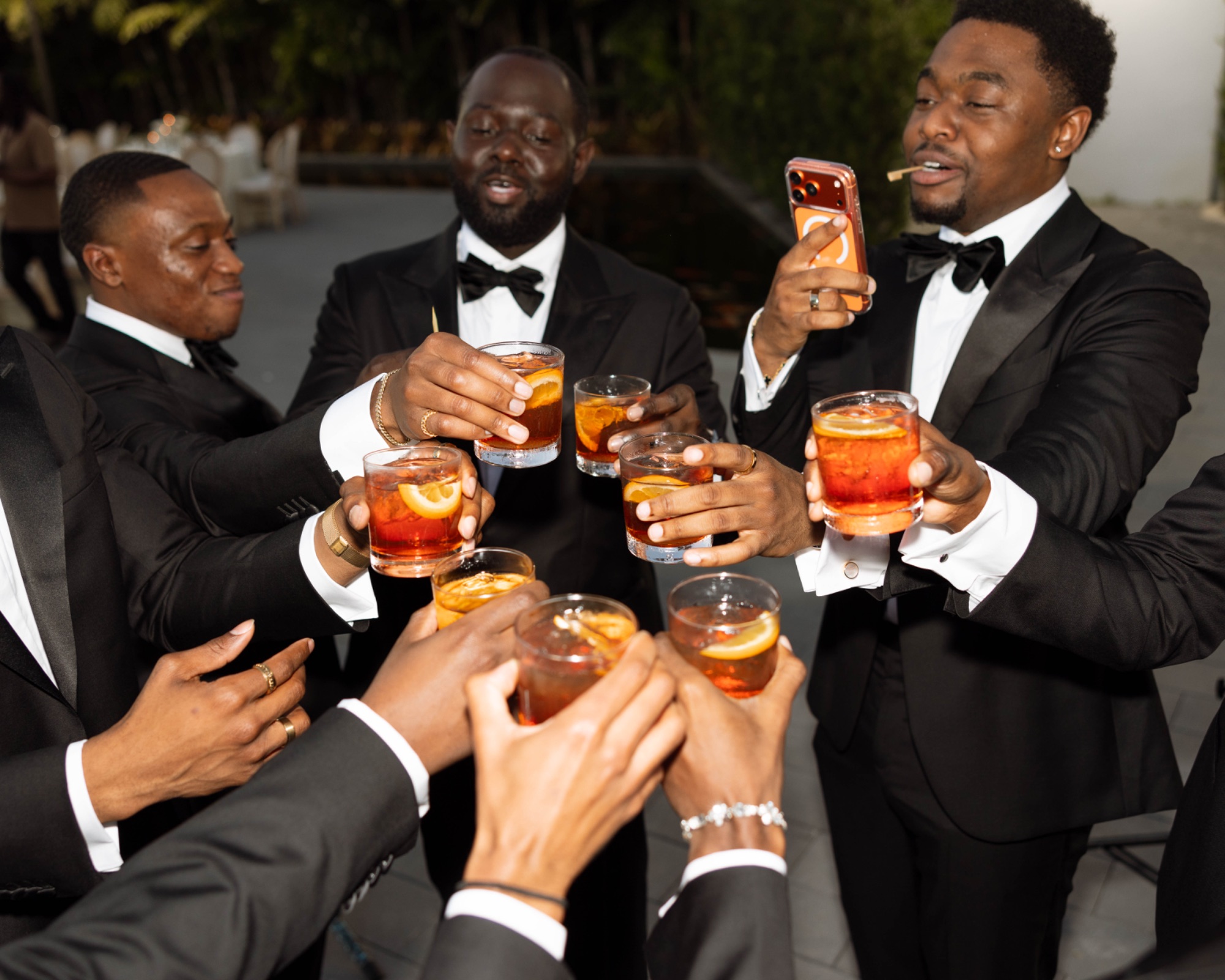 The groomsmen raising their glasses
