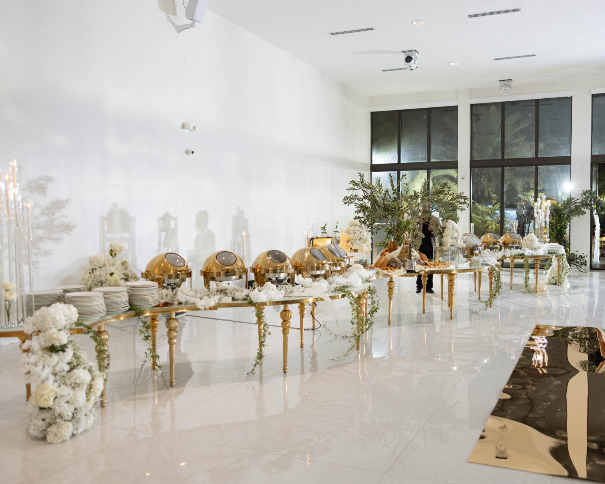 The reception room set in white and gold before the doors open