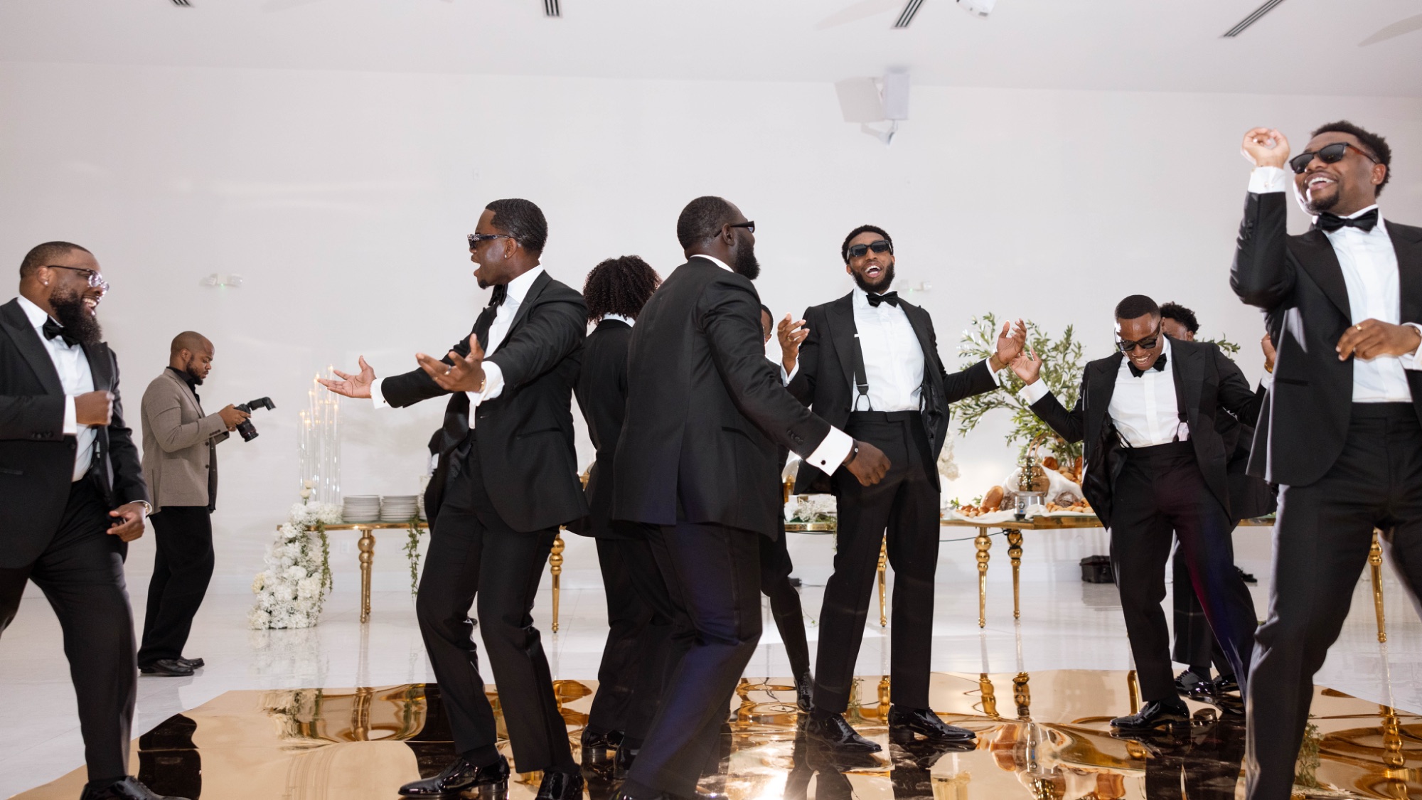The groomsmen dancing into the reception