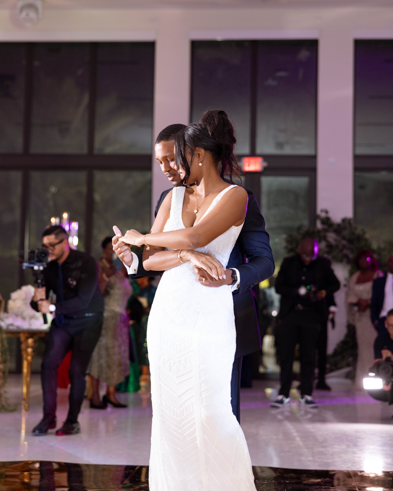 The couple during their first dance as guests watch