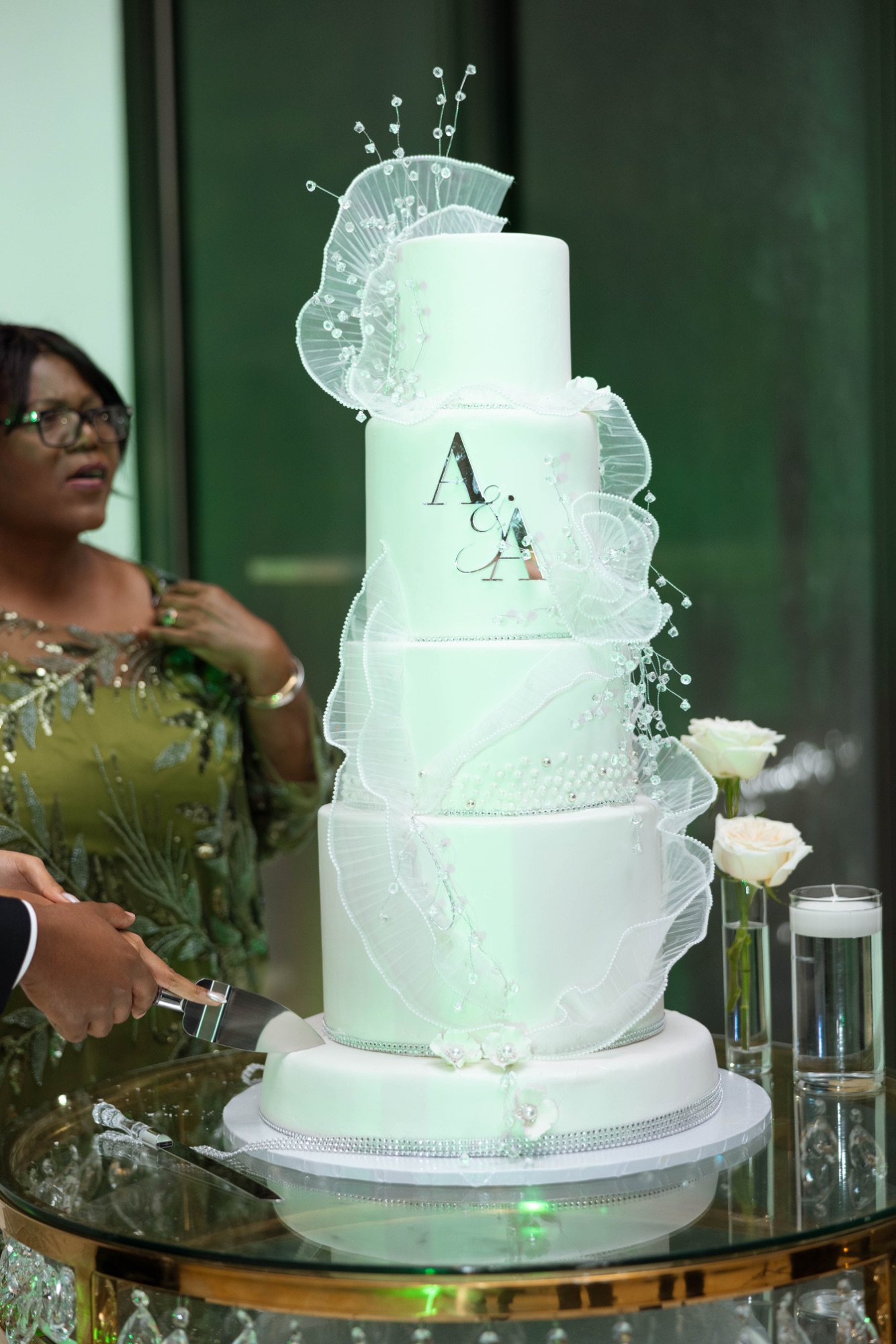 The wedding cake with the couple's monogram